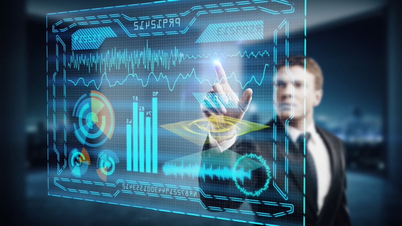 Young businessman using digital business hologram in blurry office interior with night city view. Touchscreen concept. Double exposure